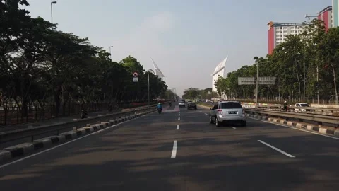 Established Shot of Driving a Car at H. Benyamin Sueb Street Stock Footage 132018577