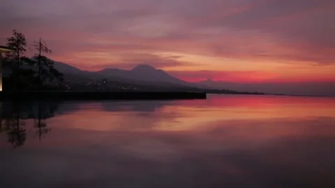 Established Shot of Epic Before Sunrise Scene with Water Reflection Stock Footage 130616623