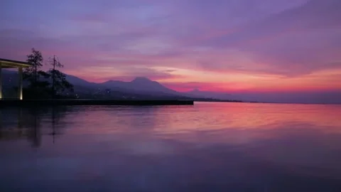 Established Shot of Epic Before Sunrise Scene with Water Reflection Stock Footage 130616710