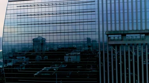 Established Shot of Jakarta Cityscape Reflected on the Building Made of Glass Stock Footage 168955689