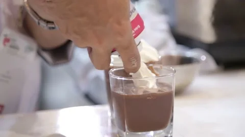 Established Shot of a Man Adding Whip Cream on Top of Frappe Stock Footage 132024845