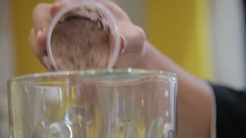Established Shot of Man Making Fresh Beverages with a Blender Machine Stock Footage 132030910