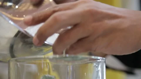 Established Shot of Man Making Fresh Beverages with a Blender Machine Stock Footage 132031042