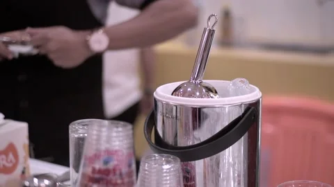 Established Shot of a Man Preparing Orange Cocktail Stock Footage 132016371