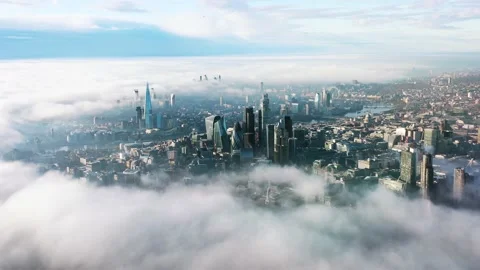 Establishing Aerial View of London with fog and clouds from abobe Stock Footage