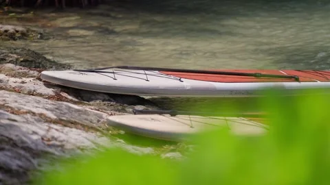 Establishing B Roll Shot of Two Paddle Boards Laying On Tropical Beach Stock Footage 288038904