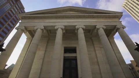 Establishing cinematic wide angle centered pan of old fashioned court house Stock Footage 147958224