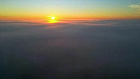 Establishing drone shot of sunset high above the clouds Stock Footage 300208608