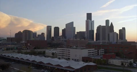 Establishing drone view of downtown Houston cityscape during sunset Stock Footage 297043679