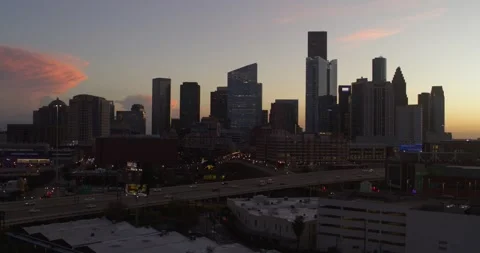 Establishing drone view of downtown Houston cityscape during sunset Stock Footage 297043680