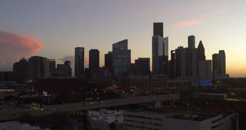 Establishing drone view of downtown Houston cityscape during sunset Stock Footage 297043707