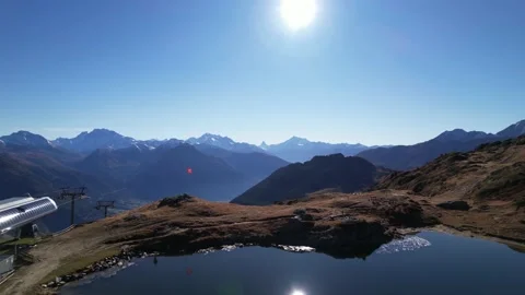 Establishing huge mountain scene with idyllic lake and Swiss flag, aerial dolly Stock Footage 164674130