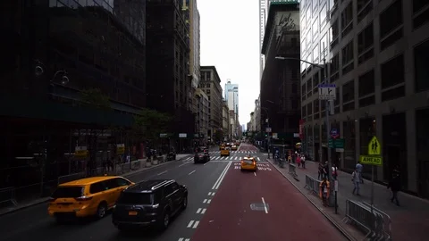 Establishing moving drone shot yellow taxi on street in New York City Manhattan. Stock Footage