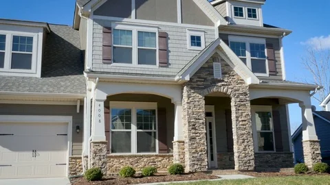 Establishing pan shot from mailbox to typical middle class American home Stock Footage 79506444