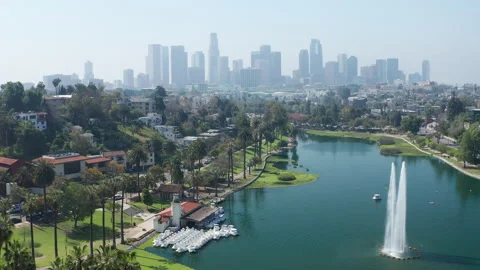 Establishing pullback shot of Los Angeles downtown skyline Echo Park palm trees Stock Footage 273838184