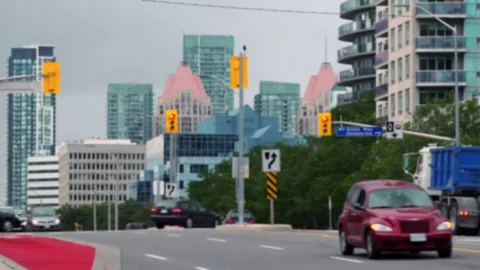 Establishing shot. City scape with traffic thru' intersection. Stock Footage 80289524