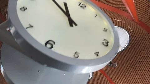 Establishing shot of a clock, camera til... | Stock Video | Pond5