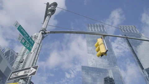 Establishing shot of clouds passing New York City's Columbus Circle and Central Stock Footage 315418934