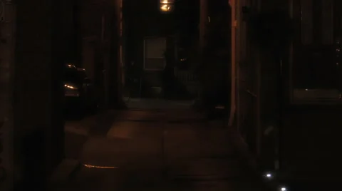 Establishing shot of a dark alleyway Stock Footage