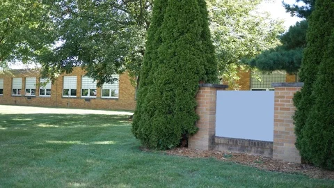 An  establishing shot of an elementary school Stock Footage 116035081
