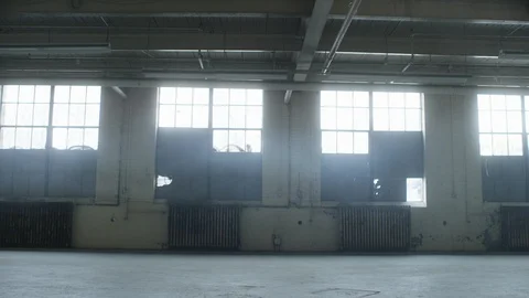 Establishing shot of empty industrial warehouse with a hint of fog in the air Stock Footage 104428010