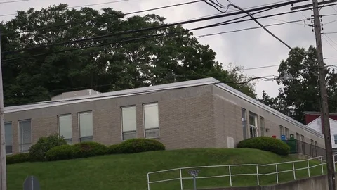 Establishing shot of Federal Post Office Building in suburban small town Stock Footage