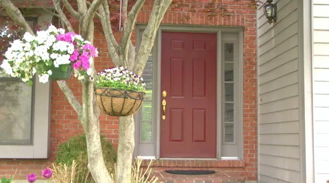 Establishing shot of front door during the daytime in spring 2 Stock Footage 50061729