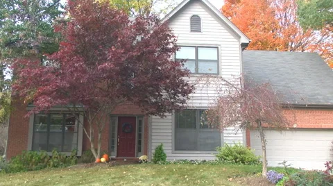 Establishing shot front of a middle class house during daytime in autumn / fall Stock Footage 56341521