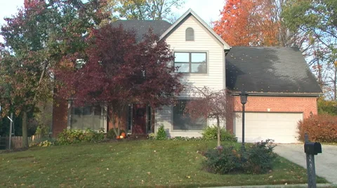 Establishing shot front of a middle class house morning or evening autumn / fall Stock Footage 56435547
