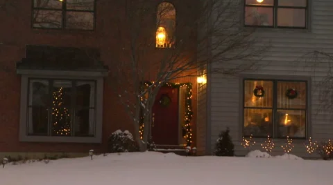 Establishing shot of the front of a middle class home at twilight and Christmas Stock Footage 58953178