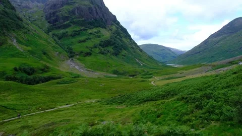 Establishing shot of Glen Coe in the Scottish Highlands Stock Footage 246747929