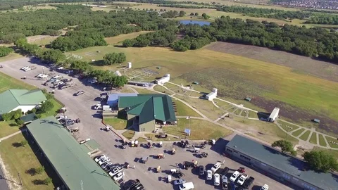 Establishing Shot of Golf Carts Exiting Skeet Shooting Event Stock Footage 76006606