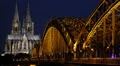 Establishing Shot Illuminated Night Light Cologne Cathedral Skyline Birds Flock HD Footage
