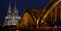 Establishing Shot Illuminated Night Light Cologne Cathedral Skyline Birds Flock 4k or 4k+ Resolution