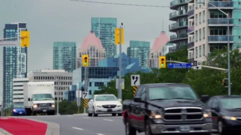 Establishing shot of intersection traffic with highrise buildings. Stock Footage 79810586