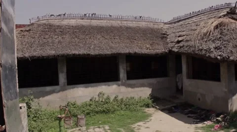 Establishing shot large simple hut with grass roof 2 of 2. Stock Footage 45183512