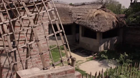 Establishing shot large simple hut with grass roof 1 of 2. Stock Footage 45183557