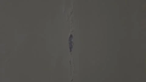 Establishing Shot of a Large Structural Crack and Mold on an Interior Wall Stock Footage 345132805