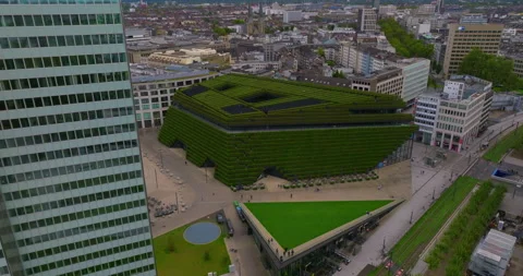 Establishing shot of the largest green facade in Europe, a green building Stock Footage 254978771