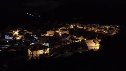 Establishing shot looking over a small town at night with all the house Stock Footage 98404471