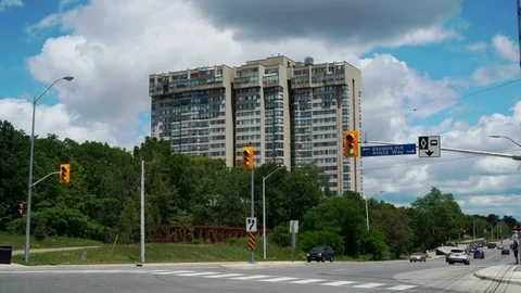 Establishing shot of multi unit building seen from street level intersection. Stock Footage 76964230