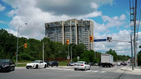 Establishing shot of multi unit building seen from street level intersection. Stock Footage 76964289
