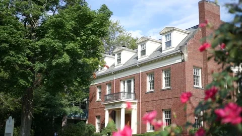 Establishing Shot of Red Brick Historical Home with Foreground Motion Stock Footage 210872425