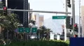 Establishing Shot Red Traffic Light Sign People Walk MGM Hotel Board Las Vegas HD Footage