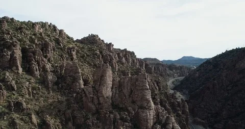 Establishing shot of rock structures in Supserstition mountains drone aerial 4K Stock Footage 111312346