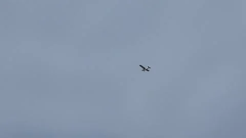 An Establishing Shot of a Single Engine Airplane Including Sound Stock Footage 139994751