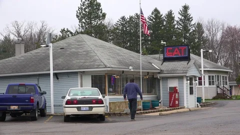 Establishing shot of a small generic roadside diner restaurant with a neon sign Video stock 79504588