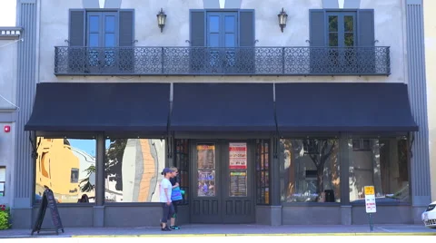 Establishing shot of a small retail storefront or music club. Video stock 46864843