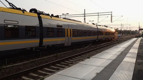 Establishing shot of a train during the evning at Alingsas station Sweden Stock Footage 115195336