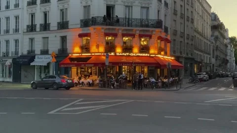 Establishing shot of a typical Paris cafe with outdoor seating Stock Footage 245494939